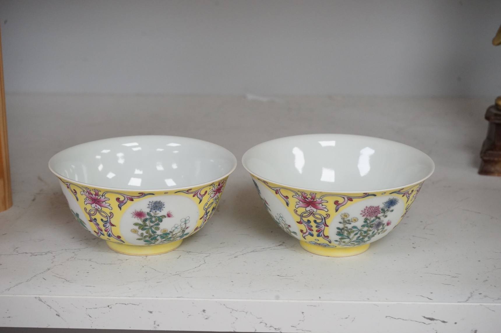 A pair of Chinese yellow ground medallion bowls, 13cm diameter